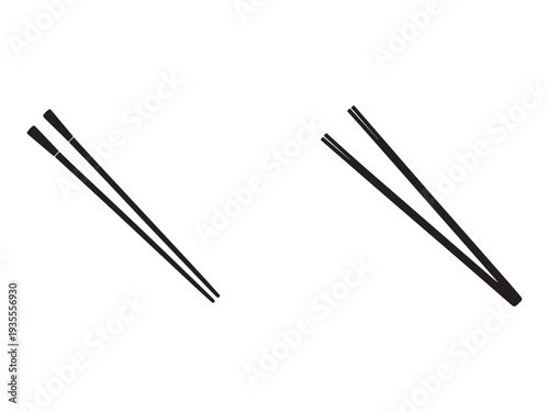 Two pairs of black chopsticks on white background  kitchen utensils for eating asian food