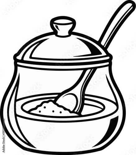 A glass sugar bowl with a lid and a spoon