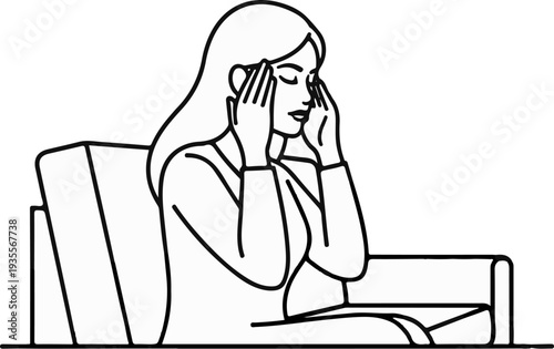 Woman sitting on sofa with hands on temples, eyes closed, appearing to have a headache