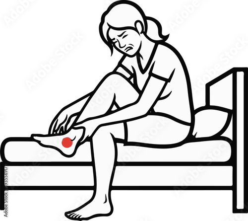 Person in bed with a red spot on their foot indicating pain