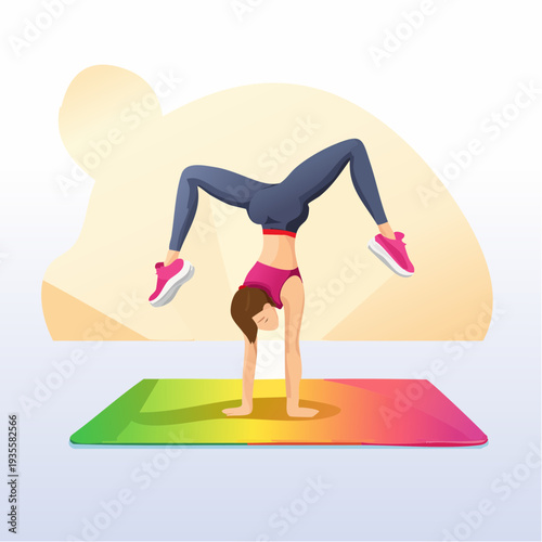 Woman performing a handstand yoga pose on a colorful mat