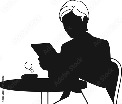 Silhouette of person engrossed in a tablet at a cafe table with coffee