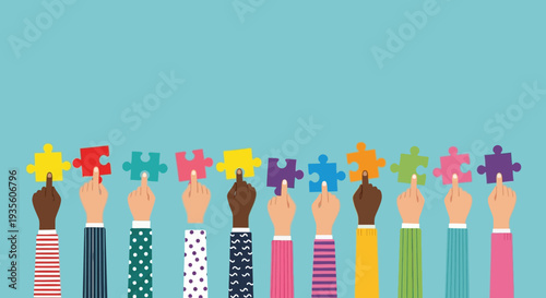 Diverse group of people holding puzzle pieces together in unity.