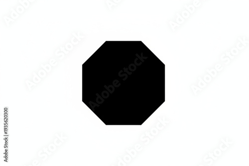 Geometric Octagon in Isolation: A striking black octagon, sharply defined against a clean backdrop, presents a study in simplicity and form.