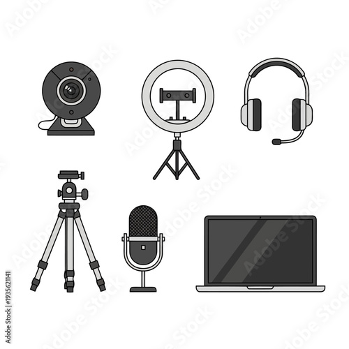 Recording equipment setup for professional video production and podcasting with camera, ring light, and microphone on a tripod and laptop nearby