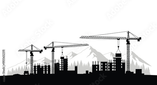 City construction site with cranes and mountains a dark silhouette