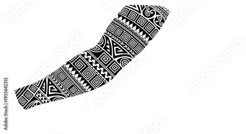 Black and white tribal boomerang with geometric patterned carving.