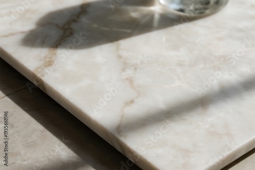Marble surface with glass and shadow