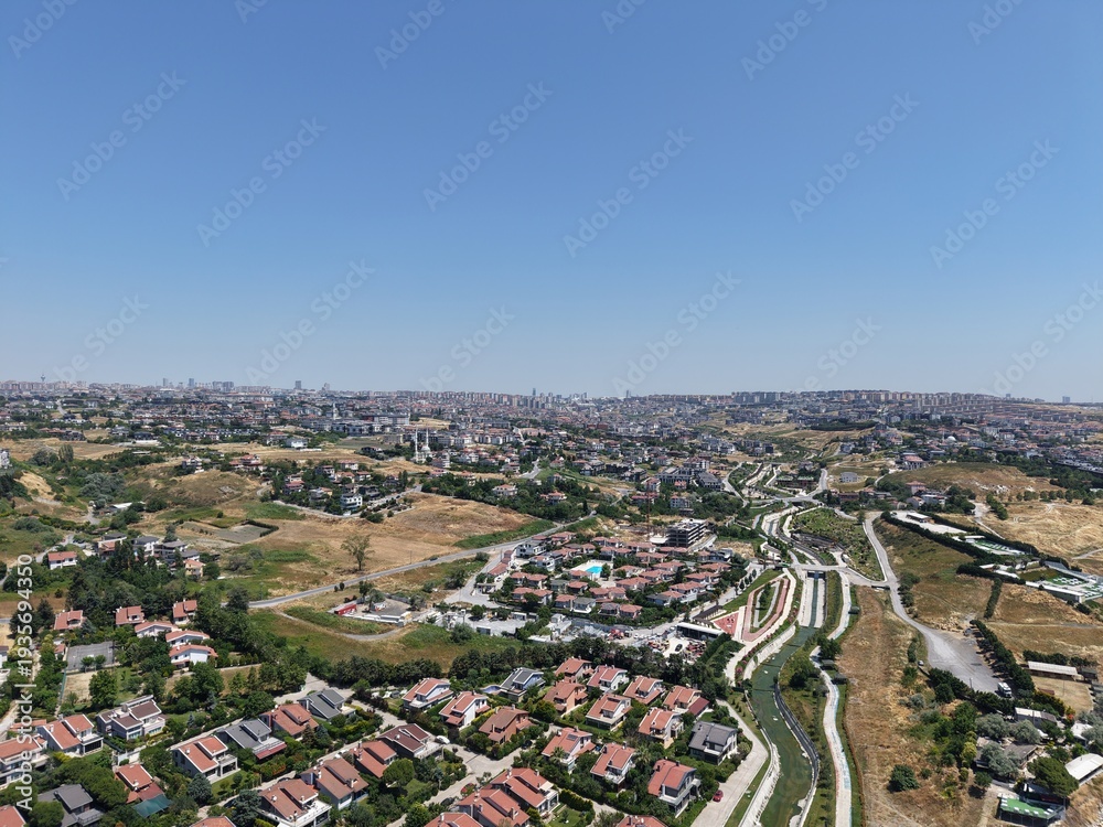 Obraz premium Aerial Panoramic View of Coastal Residential Neighborhood and Blue Sea Horizon