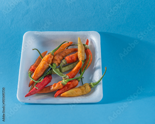 Fresh Colorful Chili Peppers in White Tray