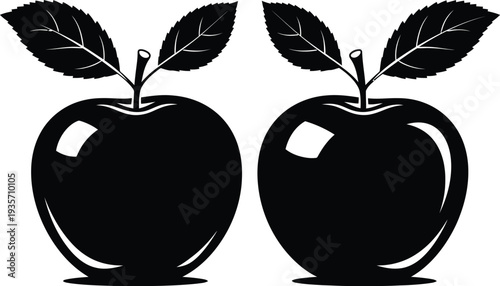 Black silhouette of two apples with leaves on white background