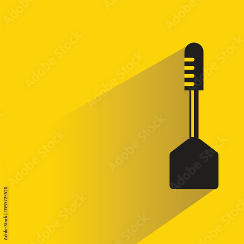 spatula icon with shadow on yellow background