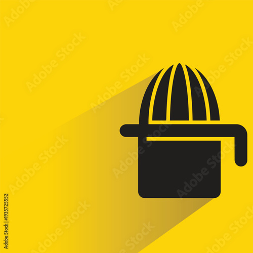 orange juicer icon with shadow on yellow background