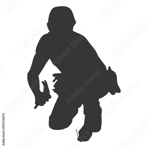 Construction worker hammering pins