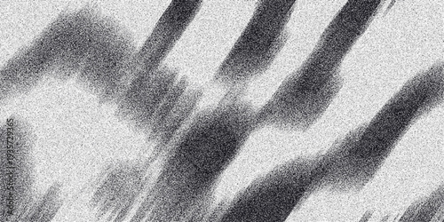 Abstract grayscale composition with blurred diagonal stripes and a speckled texture, creating a soft, motion-blurred effect for atmospheric backgrounds and artistic visuals