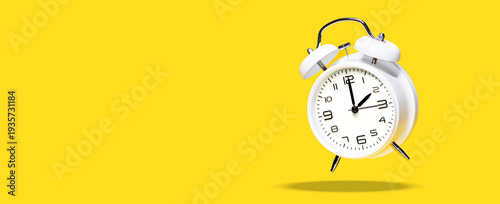 Wallpaper Mural White bell alarm clock hovering over yellow background. 2 to 3 clock concept isolated. daylight savings time change concept
 Torontodigital.ca