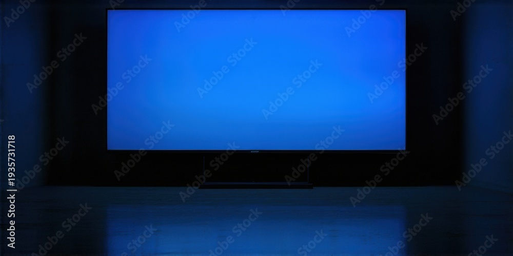 Fototapeta premium Dark room features large blue screen television. Minimalist setup, modern design, sleek presentation. Focus on display technology.