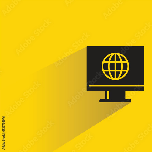 computer and globe icon with shadow on yellow background
