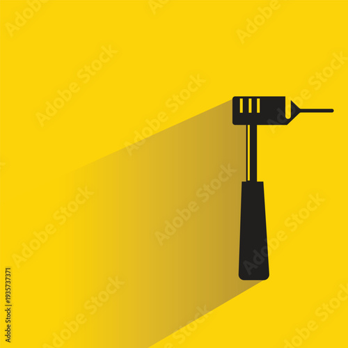 dental handpiece icon with shadow on yellow background