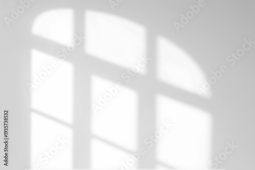 Bild auf Leinwand A blurred grayscale image depicting the abstract shadow of a window frame cast u