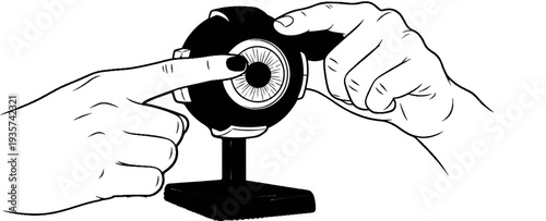 Two hands interact with a web camera, one finger touching the lens