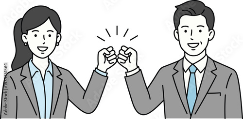 Two business people fist bumping in formal attire