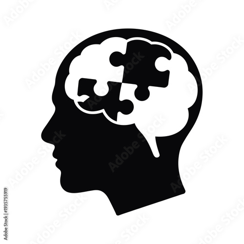 A black silhouette of a head with puzzle pieces forming the brain
