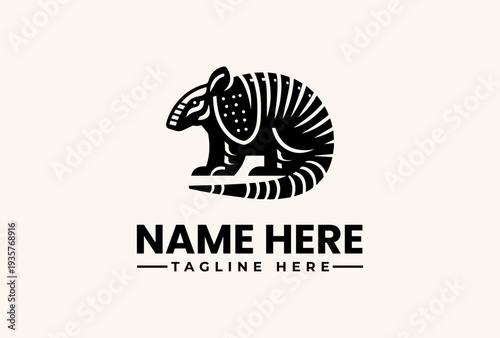 Black and white illustration of a stylized armadillo logo with a circular pattern on its shell, standing on a flat surface against a beige background, with space for a name and tagline.