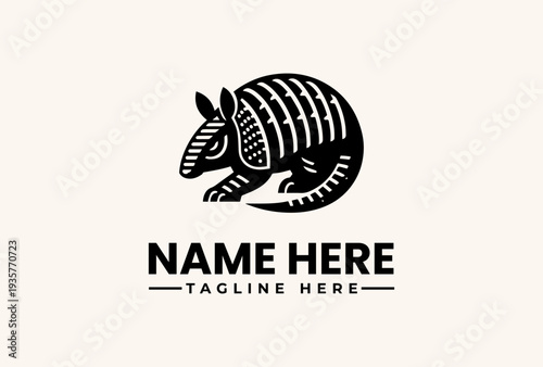 Black and white illustration of an armadillo logo with a placeholder name and tagline on a beige background, featuring a vector graphic design with clean lines and simple shapes.