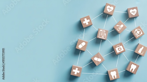 Dental icons on wooden cubes scattered on blue background oral health concept