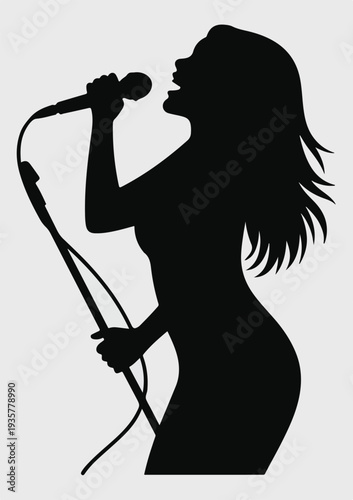 Silhouette of a woman singing into a microphone with flowing hair singer