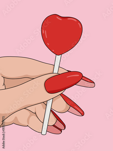 Woman's Hand Closeup Holding Glossy Red Heart Candy Lollipop Isolated on Pink Background. Cute Love Party Valentines Concept
