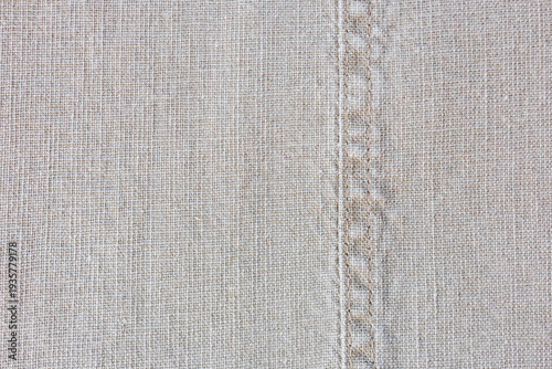 Tableau sur toile Linen textile with stitched seam macro sewing detail