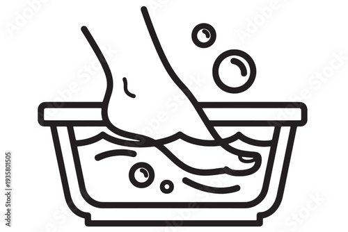 A foot soaking in a warm bath with bubbles for relaxation and foot care