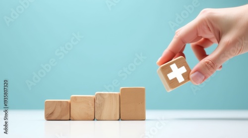 Hand adding wooden block with plus sign to row value added 
