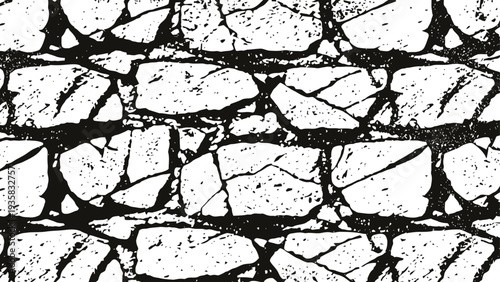 Black and white cracked brick wall texture with irregular stone pattern and rugged surface design