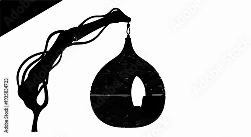 Abstract mechanical arm suspending a light bulb containing a small boat.