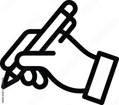 A hand holding a pen and writing