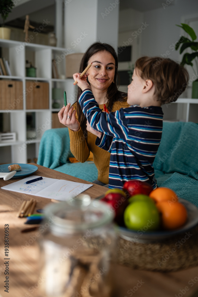 Fototapeta premium Mother and son bonding exploring creativity at home