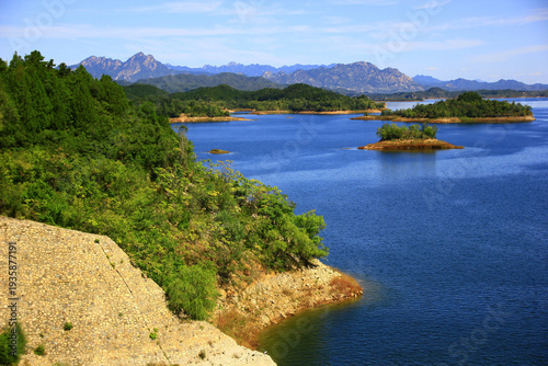 Mountain Lake with Forest Islands and Peak Range Landscape