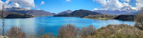 panoramic view on artificial  lake of campotosto with hills and peak mountain...