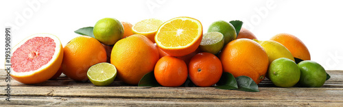 Different ripe citrus fruits on wooden table against white background