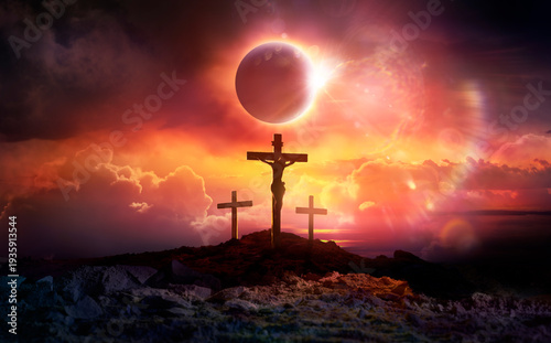 Crucifixion of Jesus Christ in Hill At Sunset Eclipse And Abstract Lights Flare Effects …and there was darkness over the whole land...