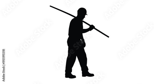 A solitary worker carrying a long pole across his shoulders walks forward depicted in stark black silhouette high quality