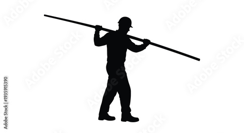 A solitary worker carries a long pole across his shoulders against a bright blank background a striking silhouette