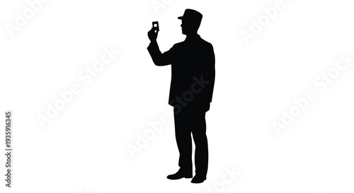 A stark black silhouette of a man taking a photograph with a mobile phone capturing a modern moment silhouette