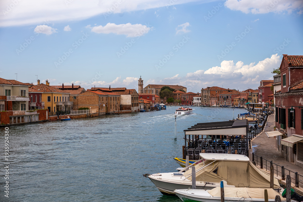 Obraz premium Main canal Murano Rio dei Vetrai Venice lagoon island venetian architecture colorful houses boats lagoon Italian tourism bell tower church turquoise water blue sky