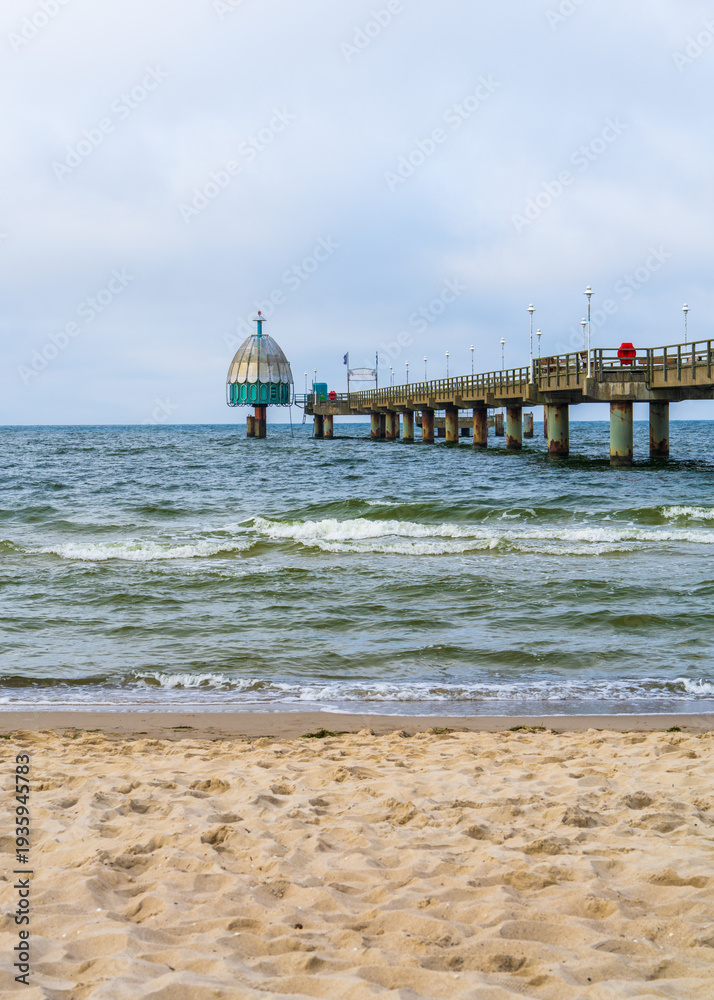 Fototapeta premium Zinnowitz pier on Usedom island at Baltic Sea, Germany. Diving gondola at seaside resort. Travel destination and coastal tourism concept.