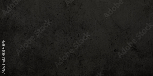 A dark and aged grunge paper background features a rough, dirty concrete texture with a vintage gray stone surface and blank black cement pattern for a textured wallpaper backdrop