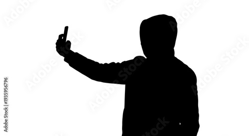 Silhouette of a hooded person.